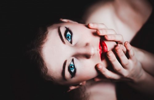 studio-shot-of-beautiful-woman-with-red-lipstick